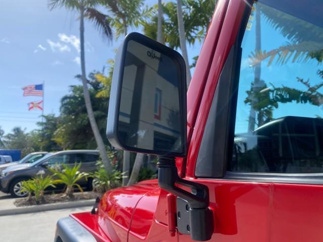 1999 Flame Red /Agate Jeep Wrangler Sport AUTO AC 4.0 6 CYL LOW MILES 92,727 (1J4FY19S2XP) with an 4.0L SMPI I6 Power Tech Engine engine, Automatic transmission, located at 4701 North Dixie Hwy, Pompano Beach, FL, 33064, (954) 422-2889, 26.240938, -80.123474 - OUR WEBPAGE FLORIDACARS1.COM HAS OVER 100 PHOTOS AND FREE CARFAX LINK 1999 Jeep Wrangler Sport 4WD Utility 4.0L I6 F Gasoline 20 MPG Rear Wheel Drive w/ 4X4 Features 4WD/AWD Air Conditioning Alloy Wheels AM/FM Stereo Automatic Transmission CD Audio Cloth Seats Cruise Control Running Boards Soft Top- Photo#38