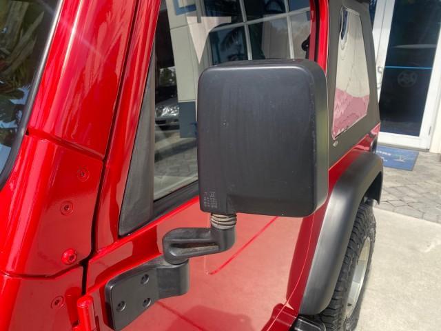 1999 Flame Red /Agate Jeep Wrangler Sport AUTO AC 4.0 6 CYL LOW MILES 92,727 (1J4FY19S2XP) with an 4.0L SMPI I6 Power Tech Engine engine, Automatic transmission, located at 4701 North Dixie Hwy, Pompano Beach, FL, 33064, (954) 422-2889, 26.240938, -80.123474 - OUR WEBPAGE FLORIDACARS1.COM HAS OVER 100 PHOTOS AND FREE CARFAX LINK 1999 Jeep Wrangler Sport 4WD Utility 4.0L I6 F Gasoline 20 MPG Rear Wheel Drive w/ 4X4 Features 4WD/AWD Air Conditioning Alloy Wheels AM/FM Stereo Automatic Transmission CD Audio Cloth Seats Cruise Control Running Boards Soft Top- Photo#39