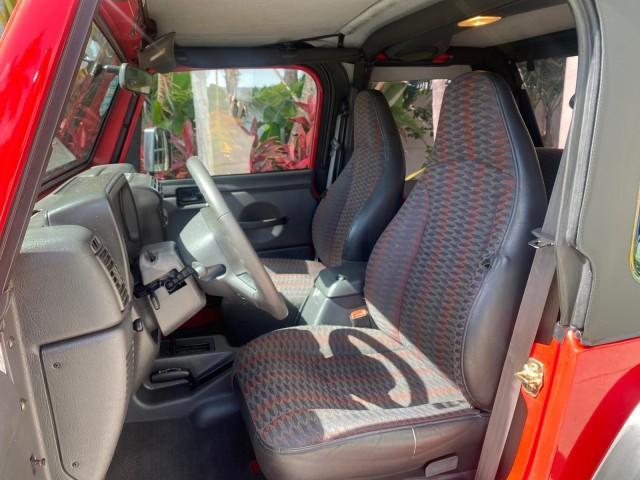 1999 Flame Red /Agate Jeep Wrangler Sport AUTO AC 4.0 6 CYL LOW MILES 92,727 (1J4FY19S2XP) with an 4.0L SMPI I6 Power Tech Engine engine, Automatic transmission, located at 4701 North Dixie Hwy, Pompano Beach, FL, 33064, (954) 422-2889, 26.240938, -80.123474 - OUR WEBPAGE FLORIDACARS1.COM HAS OVER 100 PHOTOS AND FREE CARFAX LINK 1999 Jeep Wrangler Sport 4WD Utility 4.0L I6 F Gasoline 20 MPG Rear Wheel Drive w/ 4X4 Features 4WD/AWD Air Conditioning Alloy Wheels AM/FM Stereo Automatic Transmission CD Audio Cloth Seats Cruise Control Running Boards Soft Top- Photo#44