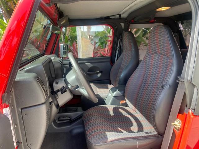 1999 Flame Red /Agate Jeep Wrangler Sport AUTO AC 4.0 6 CYL LOW MILES 92,727 (1J4FY19S2XP) with an 4.0L SMPI I6 Power Tech Engine engine, Automatic transmission, located at 4701 North Dixie Hwy, Pompano Beach, FL, 33064, (954) 422-2889, 26.240938, -80.123474 - OUR WEBPAGE FLORIDACARS1.COM HAS OVER 100 PHOTOS AND FREE CARFAX LINK 1999 Jeep Wrangler Sport 4WD Utility 4.0L I6 F Gasoline 20 MPG Rear Wheel Drive w/ 4X4 Features 4WD/AWD Air Conditioning Alloy Wheels AM/FM Stereo Automatic Transmission CD Audio Cloth Seats Cruise Control Running Boards Soft Top- Photo#45
