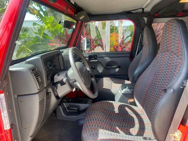 1999 Flame Red /Agate Jeep Wrangler Sport AUTO AC 4.0 6 CYL LOW MILES 92,727 (1J4FY19S2XP) with an 4.0L SMPI I6 Power Tech Engine engine, Automatic transmission, located at 4701 North Dixie Hwy, Pompano Beach, FL, 33064, (954) 422-2889, 26.240938, -80.123474 - OUR WEBPAGE FLORIDACARS1.COM HAS OVER 100 PHOTOS AND FREE CARFAX LINK 1999 Jeep Wrangler Sport 4WD Utility 4.0L I6 F Gasoline 20 MPG Rear Wheel Drive w/ 4X4 Features 4WD/AWD Air Conditioning Alloy Wheels AM/FM Stereo Automatic Transmission CD Audio Cloth Seats Cruise Control Running Boards Soft Top- Photo#46