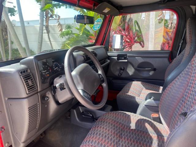 1999 Flame Red /Agate Jeep Wrangler Sport AUTO AC 4.0 6 CYL LOW MILES 92,727 (1J4FY19S2XP) with an 4.0L SMPI I6 Power Tech Engine engine, Automatic transmission, located at 4701 North Dixie Hwy, Pompano Beach, FL, 33064, (954) 422-2889, 26.240938, -80.123474 - OUR WEBPAGE FLORIDACARS1.COM HAS OVER 100 PHOTOS AND FREE CARFAX LINK 1999 Jeep Wrangler Sport 4WD Utility 4.0L I6 F Gasoline 20 MPG Rear Wheel Drive w/ 4X4 Features 4WD/AWD Air Conditioning Alloy Wheels AM/FM Stereo Automatic Transmission CD Audio Cloth Seats Cruise Control Running Boards Soft Top- Photo#47