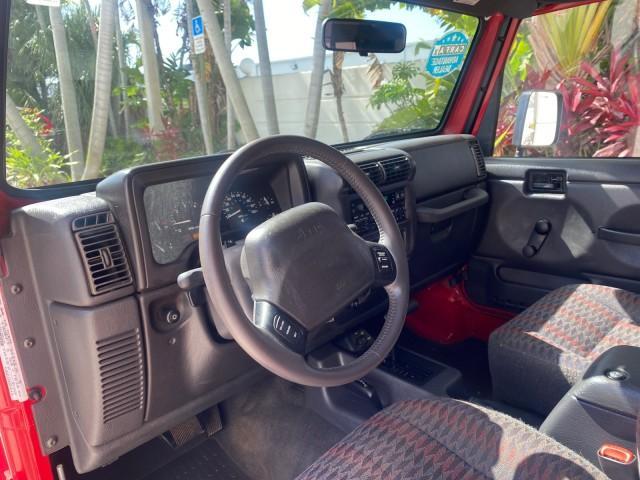 1999 Flame Red /Agate Jeep Wrangler Sport AUTO AC 4.0 6 CYL LOW MILES 92,727 (1J4FY19S2XP) with an 4.0L SMPI I6 Power Tech Engine engine, Automatic transmission, located at 4701 North Dixie Hwy, Pompano Beach, FL, 33064, (954) 422-2889, 26.240938, -80.123474 - OUR WEBPAGE FLORIDACARS1.COM HAS OVER 100 PHOTOS AND FREE CARFAX LINK 1999 Jeep Wrangler Sport 4WD Utility 4.0L I6 F Gasoline 20 MPG Rear Wheel Drive w/ 4X4 Features 4WD/AWD Air Conditioning Alloy Wheels AM/FM Stereo Automatic Transmission CD Audio Cloth Seats Cruise Control Running Boards Soft Top- Photo#49