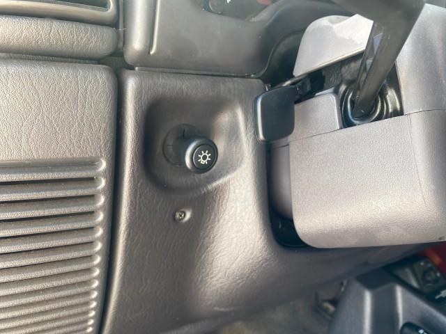 1999 Flame Red /Agate Jeep Wrangler Sport AUTO AC 4.0 6 CYL LOW MILES 92,727 (1J4FY19S2XP) with an 4.0L SMPI I6 Power Tech Engine engine, Automatic transmission, located at 4701 North Dixie Hwy, Pompano Beach, FL, 33064, (954) 422-2889, 26.240938, -80.123474 - OUR WEBPAGE FLORIDACARS1.COM HAS OVER 100 PHOTOS AND FREE CARFAX LINK 1999 Jeep Wrangler Sport 4WD Utility 4.0L I6 F Gasoline 20 MPG Rear Wheel Drive w/ 4X4 Features 4WD/AWD Air Conditioning Alloy Wheels AM/FM Stereo Automatic Transmission CD Audio Cloth Seats Cruise Control Running Boards Soft Top- Photo#56