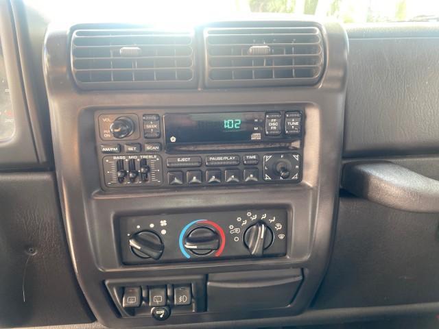1999 Flame Red /Agate Jeep Wrangler Sport AUTO AC 4.0 6 CYL LOW MILES 92,727 (1J4FY19S2XP) with an 4.0L SMPI I6 Power Tech Engine engine, Automatic transmission, located at 4701 North Dixie Hwy, Pompano Beach, FL, 33064, (954) 422-2889, 26.240938, -80.123474 - OUR WEBPAGE FLORIDACARS1.COM HAS OVER 100 PHOTOS AND FREE CARFAX LINK 1999 Jeep Wrangler Sport 4WD Utility 4.0L I6 F Gasoline 20 MPG Rear Wheel Drive w/ 4X4 Features 4WD/AWD Air Conditioning Alloy Wheels AM/FM Stereo Automatic Transmission CD Audio Cloth Seats Cruise Control Running Boards Soft Top- Photo#59