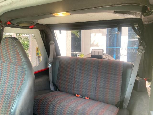 1999 Flame Red /Agate Jeep Wrangler Sport AUTO AC 4.0 6 CYL LOW MILES 92,727 (1J4FY19S2XP) with an 4.0L SMPI I6 Power Tech Engine engine, Automatic transmission, located at 4701 North Dixie Hwy, Pompano Beach, FL, 33064, (954) 422-2889, 26.240938, -80.123474 - OUR WEBPAGE FLORIDACARS1.COM HAS OVER 100 PHOTOS AND FREE CARFAX LINK 1999 Jeep Wrangler Sport 4WD Utility 4.0L I6 F Gasoline 20 MPG Rear Wheel Drive w/ 4X4 Features 4WD/AWD Air Conditioning Alloy Wheels AM/FM Stereo Automatic Transmission CD Audio Cloth Seats Cruise Control Running Boards Soft Top- Photo#73