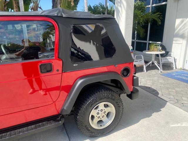 1999 Flame Red /Agate Jeep Wrangler Sport AUTO AC 4.0 6 CYL LOW MILES 92,727 (1J4FY19S2XP) with an 4.0L SMPI I6 Power Tech Engine engine, Automatic transmission, located at 4701 North Dixie Hwy, Pompano Beach, FL, 33064, (954) 422-2889, 26.240938, -80.123474 - OUR WEBPAGE FLORIDACARS1.COM HAS OVER 100 PHOTOS AND FREE CARFAX LINK 1999 Jeep Wrangler Sport 4WD Utility 4.0L I6 F Gasoline 20 MPG Rear Wheel Drive w/ 4X4 Features 4WD/AWD Air Conditioning Alloy Wheels AM/FM Stereo Automatic Transmission CD Audio Cloth Seats Cruise Control Running Boards Soft Top- Photo#74