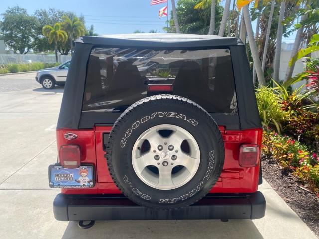 1999 Flame Red /Agate Jeep Wrangler Sport AUTO AC 4.0 6 CYL LOW MILES 92,727 (1J4FY19S2XP) with an 4.0L SMPI I6 Power Tech Engine engine, Automatic transmission, located at 4701 North Dixie Hwy, Pompano Beach, FL, 33064, (954) 422-2889, 26.240938, -80.123474 - OUR WEBPAGE FLORIDACARS1.COM HAS OVER 100 PHOTOS AND FREE CARFAX LINK 1999 Jeep Wrangler Sport 4WD Utility 4.0L I6 F Gasoline 20 MPG Rear Wheel Drive w/ 4X4 Features 4WD/AWD Air Conditioning Alloy Wheels AM/FM Stereo Automatic Transmission CD Audio Cloth Seats Cruise Control Running Boards Soft Top- Photo#80