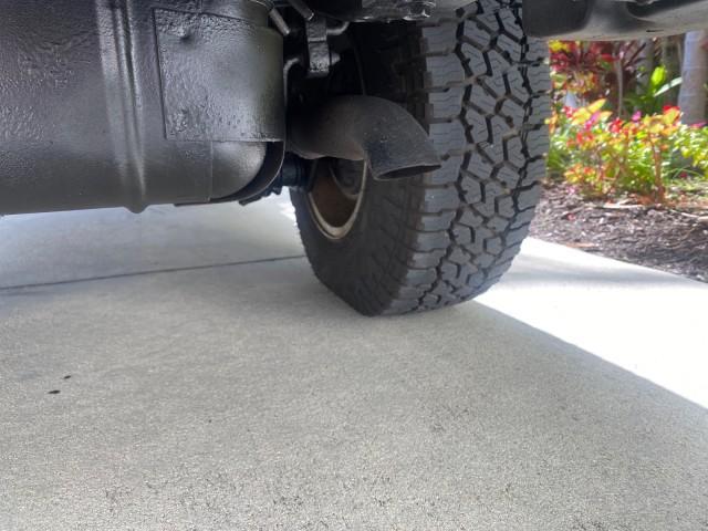 1999 Flame Red /Agate Jeep Wrangler Sport AUTO AC 4.0 6 CYL LOW MILES 92,727 (1J4FY19S2XP) with an 4.0L SMPI I6 Power Tech Engine engine, Automatic transmission, located at 4701 North Dixie Hwy, Pompano Beach, FL, 33064, (954) 422-2889, 26.240938, -80.123474 - OUR WEBPAGE FLORIDACARS1.COM HAS OVER 100 PHOTOS AND FREE CARFAX LINK 1999 Jeep Wrangler Sport 4WD Utility 4.0L I6 F Gasoline 20 MPG Rear Wheel Drive w/ 4X4 Features 4WD/AWD Air Conditioning Alloy Wheels AM/FM Stereo Automatic Transmission CD Audio Cloth Seats Cruise Control Running Boards Soft Top- Photo#82