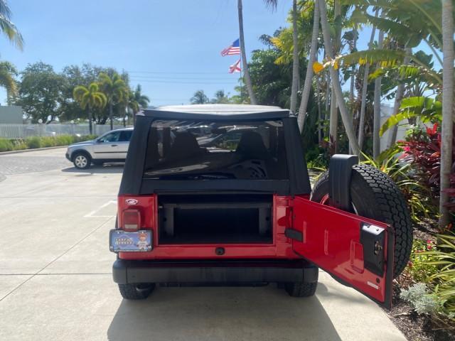 1999 Flame Red /Agate Jeep Wrangler Sport AUTO AC 4.0 6 CYL LOW MILES 92,727 (1J4FY19S2XP) with an 4.0L SMPI I6 Power Tech Engine engine, Automatic transmission, located at 4701 North Dixie Hwy, Pompano Beach, FL, 33064, (954) 422-2889, 26.240938, -80.123474 - OUR WEBPAGE FLORIDACARS1.COM HAS OVER 100 PHOTOS AND FREE CARFAX LINK 1999 Jeep Wrangler Sport 4WD Utility 4.0L I6 F Gasoline 20 MPG Rear Wheel Drive w/ 4X4 Features 4WD/AWD Air Conditioning Alloy Wheels AM/FM Stereo Automatic Transmission CD Audio Cloth Seats Cruise Control Running Boards Soft Top- Photo#84