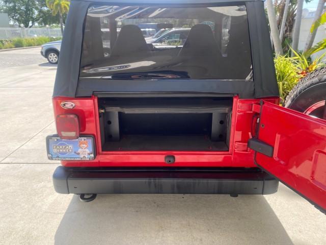 1999 Flame Red /Agate Jeep Wrangler Sport AUTO AC 4.0 6 CYL LOW MILES 92,727 (1J4FY19S2XP) with an 4.0L SMPI I6 Power Tech Engine engine, Automatic transmission, located at 4701 North Dixie Hwy, Pompano Beach, FL, 33064, (954) 422-2889, 26.240938, -80.123474 - OUR WEBPAGE FLORIDACARS1.COM HAS OVER 100 PHOTOS AND FREE CARFAX LINK 1999 Jeep Wrangler Sport 4WD Utility 4.0L I6 F Gasoline 20 MPG Rear Wheel Drive w/ 4X4 Features 4WD/AWD Air Conditioning Alloy Wheels AM/FM Stereo Automatic Transmission CD Audio Cloth Seats Cruise Control Running Boards Soft Top- Photo#85