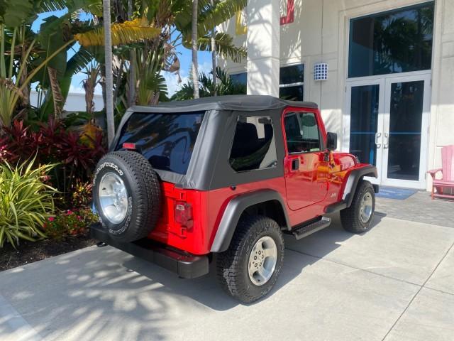 1999 Flame Red /Agate Jeep Wrangler Sport AUTO AC 4.0 6 CYL LOW MILES 92,727 (1J4FY19S2XP) with an 4.0L SMPI I6 Power Tech Engine engine, Automatic transmission, located at 4701 North Dixie Hwy, Pompano Beach, FL, 33064, (954) 422-2889, 26.240938, -80.123474 - OUR WEBPAGE FLORIDACARS1.COM HAS OVER 100 PHOTOS AND FREE CARFAX LINK 1999 Jeep Wrangler Sport 4WD Utility 4.0L I6 F Gasoline 20 MPG Rear Wheel Drive w/ 4X4 Features 4WD/AWD Air Conditioning Alloy Wheels AM/FM Stereo Automatic Transmission CD Audio Cloth Seats Cruise Control Running Boards Soft Top- Photo#89