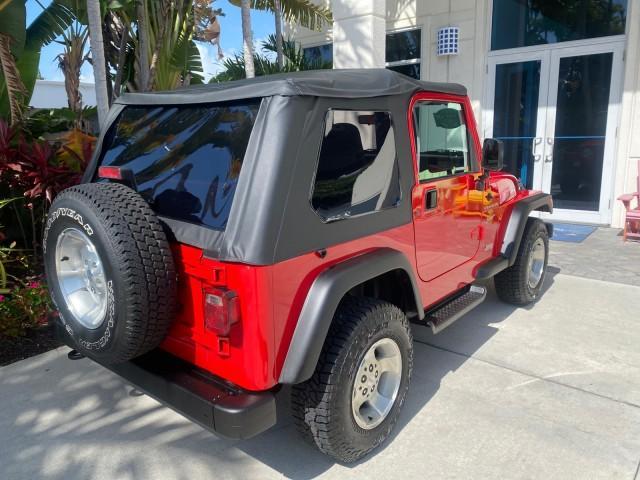 1999 Flame Red /Agate Jeep Wrangler Sport AUTO AC 4.0 6 CYL LOW MILES 92,727 (1J4FY19S2XP) with an 4.0L SMPI I6 Power Tech Engine engine, Automatic transmission, located at 4701 North Dixie Hwy, Pompano Beach, FL, 33064, (954) 422-2889, 26.240938, -80.123474 - OUR WEBPAGE FLORIDACARS1.COM HAS OVER 100 PHOTOS AND FREE CARFAX LINK 1999 Jeep Wrangler Sport 4WD Utility 4.0L I6 F Gasoline 20 MPG Rear Wheel Drive w/ 4X4 Features 4WD/AWD Air Conditioning Alloy Wheels AM/FM Stereo Automatic Transmission CD Audio Cloth Seats Cruise Control Running Boards Soft Top- Photo#90