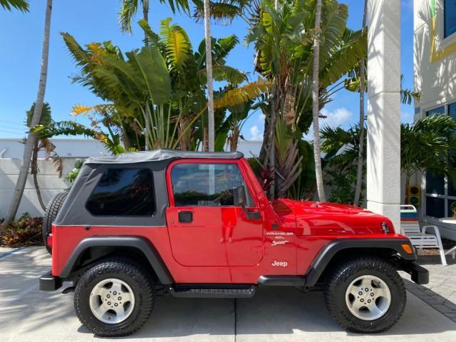 1999 Flame Red /Agate Jeep Wrangler Sport AUTO AC 4.0 6 CYL LOW MILES 92,727 (1J4FY19S2XP) with an 4.0L SMPI I6 Power Tech Engine engine, Automatic transmission, located at 4701 North Dixie Hwy, Pompano Beach, FL, 33064, (954) 422-2889, 26.240938, -80.123474 - OUR WEBPAGE FLORIDACARS1.COM HAS OVER 100 PHOTOS AND FREE CARFAX LINK 1999 Jeep Wrangler Sport 4WD Utility 4.0L I6 F Gasoline 20 MPG Rear Wheel Drive w/ 4X4 Features 4WD/AWD Air Conditioning Alloy Wheels AM/FM Stereo Automatic Transmission CD Audio Cloth Seats Cruise Control Running Boards Soft Top- Photo#92