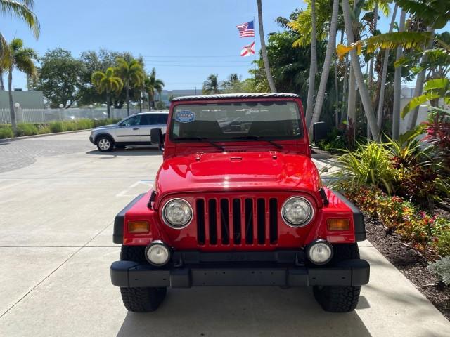 1999 Flame Red /Agate Jeep Wrangler Sport AUTO AC 4.0 6 CYL LOW MILES 92,727 (1J4FY19S2XP) with an 4.0L SMPI I6 Power Tech Engine engine, Automatic transmission, located at 4701 North Dixie Hwy, Pompano Beach, FL, 33064, (954) 422-2889, 26.240938, -80.123474 - OUR WEBPAGE FLORIDACARS1.COM HAS OVER 100 PHOTOS AND FREE CARFAX LINK 1999 Jeep Wrangler Sport 4WD Utility 4.0L I6 F Gasoline 20 MPG Rear Wheel Drive w/ 4X4 Features 4WD/AWD Air Conditioning Alloy Wheels AM/FM Stereo Automatic Transmission CD Audio Cloth Seats Cruise Control Running Boards Soft Top- Photo#95