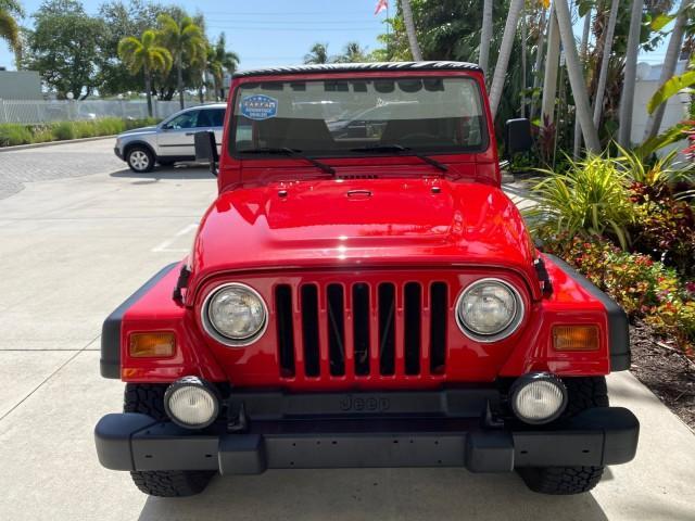 1999 Flame Red /Agate Jeep Wrangler Sport AUTO AC 4.0 6 CYL LOW MILES 92,727 (1J4FY19S2XP) with an 4.0L SMPI I6 Power Tech Engine engine, Automatic transmission, located at 4701 North Dixie Hwy, Pompano Beach, FL, 33064, (954) 422-2889, 26.240938, -80.123474 - OUR WEBPAGE FLORIDACARS1.COM HAS OVER 100 PHOTOS AND FREE CARFAX LINK 1999 Jeep Wrangler Sport 4WD Utility 4.0L I6 F Gasoline 20 MPG Rear Wheel Drive w/ 4X4 Features 4WD/AWD Air Conditioning Alloy Wheels AM/FM Stereo Automatic Transmission CD Audio Cloth Seats Cruise Control Running Boards Soft Top- Photo#96