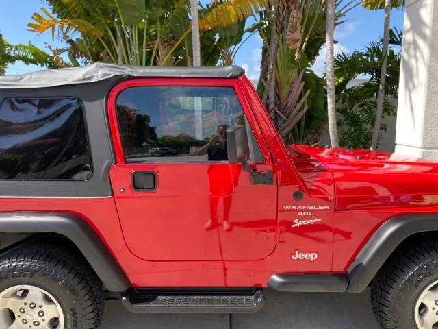 1999 Flame Red /Agate Jeep Wrangler Sport AUTO AC 4.0 6 CYL LOW MILES 92,727 (1J4FY19S2XP) with an 4.0L SMPI I6 Power Tech Engine engine, Automatic transmission, located at 4701 North Dixie Hwy, Pompano Beach, FL, 33064, (954) 422-2889, 26.240938, -80.123474 - OUR WEBPAGE FLORIDACARS1.COM HAS OVER 100 PHOTOS AND FREE CARFAX LINK 1999 Jeep Wrangler Sport 4WD Utility 4.0L I6 F Gasoline 20 MPG Rear Wheel Drive w/ 4X4 Features 4WD/AWD Air Conditioning Alloy Wheels AM/FM Stereo Automatic Transmission CD Audio Cloth Seats Cruise Control Running Boards Soft Top- Photo#99