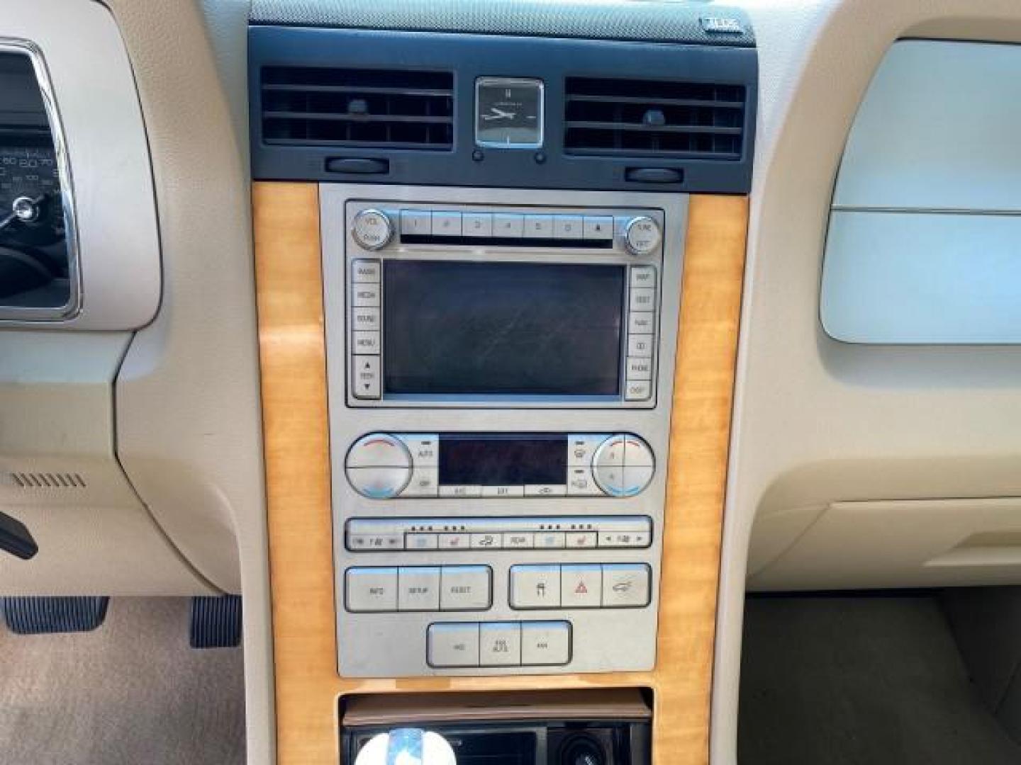 2010 White Platinum Tri-Coat Metallic /Camel Lincoln Navigator 4WD SUNROOF LOW MILES 31,209 (5LMJJ2J50AE) with an 5.4L SOHC 24-Valve V8 FFV Engine engine, Automatic transmission, located at 4701 North Dixie Hwy, Pompano Beach, FL, 33064, (954) 422-2889, 26.240938, -80.123474 - OUR WEBPAGE FLORIDACARS1.COM HAS OVER 100 PHOTOS AND FREE CARFAX LINK 2010 Lincoln Navigator 4 Door Wagon/Sport Utility 5.4L V8 F SOHC 24V Flex Fuel 18 MPG Rear Wheel Drive w/ 4X4 Features 20 Inch Plus Wheels 4WD/AWD A/C Seat(s) ABS Brakes Air Conditioning Alloy Wheels AM/FM Stereo Automatic Transmi- Photo#57