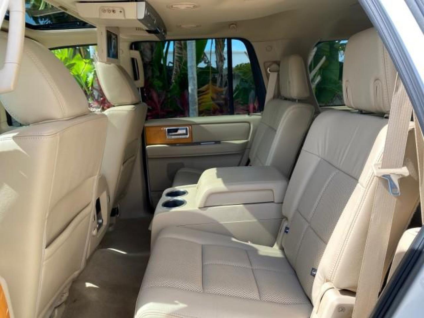 2010 White Platinum Tri-Coat Metallic /Camel Lincoln Navigator 4WD SUNROOF LOW MILES 31,209 (5LMJJ2J50AE) with an 5.4L SOHC 24-Valve V8 FFV Engine engine, Automatic transmission, located at 4701 North Dixie Hwy, Pompano Beach, FL, 33064, (954) 422-2889, 26.240938, -80.123474 - OUR WEBPAGE FLORIDACARS1.COM HAS OVER 100 PHOTOS AND FREE CARFAX LINK 2010 Lincoln Navigator 4 Door Wagon/Sport Utility 5.4L V8 F SOHC 24V Flex Fuel 18 MPG Rear Wheel Drive w/ 4X4 Features 20 Inch Plus Wheels 4WD/AWD A/C Seat(s) ABS Brakes Air Conditioning Alloy Wheels AM/FM Stereo Automatic Transmi- Photo#80