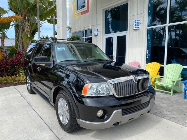2004 Black /Light Parchment Lincoln Navigator LOW MILES 67,511 SUNROOF (5LMFU27R54L) with an 5.4L DOHC 32-Valve V8 Intech Engine engine, Automatic transmission, located at 4701 North Dixie Hwy, Pompano Beach, FL, 33064, (954) 422-2889, 26.240938, -80.123474 - OUR WEBPAGE FLORIDACARS1.COM HAS OVER 100 PHOTOS AND FREE CARFAX LINK 2004 Lincoln Navigator 4 Door Wagon/Sport Utility 5.4L V8 F DOHC Gasoline 17 MPG Rear Wheel Drive Features A/C Seat(s) ABS Brakes Air Conditioning Alloy Wheels AM/FM Stereo Automatic Transmission CD Audio Cruise Control Fold-Away- Photo#1