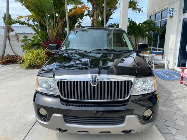 2004 Black /Light Parchment Lincoln Navigator LOW MILES 67,511 SUNROOF (5LMFU27R54L) with an 5.4L DOHC 32-Valve V8 Intech Engine engine, Automatic transmission, located at 4701 North Dixie Hwy, Pompano Beach, FL, 33064, (954) 422-2889, 26.240938, -80.123474 - OUR WEBPAGE FLORIDACARS1.COM HAS OVER 100 PHOTOS AND FREE CARFAX LINK 2004 Lincoln Navigator 4 Door Wagon/Sport Utility 5.4L V8 F DOHC Gasoline 17 MPG Rear Wheel Drive Features A/C Seat(s) ABS Brakes Air Conditioning Alloy Wheels AM/FM Stereo Automatic Transmission CD Audio Cruise Control Fold-Away- Photo#2
