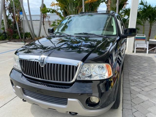2004 Black /Light Parchment Lincoln Navigator LOW MILES 67,511 SUNROOF (5LMFU27R54L) with an 5.4L DOHC 32-Valve V8 Intech Engine engine, Automatic transmission, located at 4701 North Dixie Hwy, Pompano Beach, FL, 33064, (954) 422-2889, 26.240938, -80.123474 - OUR WEBPAGE FLORIDACARS1.COM HAS OVER 100 PHOTOS AND FREE CARFAX LINK 2004 Lincoln Navigator 4 Door Wagon/Sport Utility 5.4L V8 F DOHC Gasoline 17 MPG Rear Wheel Drive Features A/C Seat(s) ABS Brakes Air Conditioning Alloy Wheels AM/FM Stereo Automatic Transmission CD Audio Cruise Control Fold-Away- Photo#3
