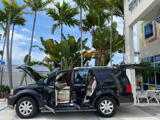 2004 Black /Light Parchment Lincoln Navigator LOW MILES 67,511 SUNROOF (5LMFU27R54L) with an 5.4L DOHC 32-Valve V8 Intech Engine engine, Automatic transmission, located at 4701 North Dixie Hwy, Pompano Beach, FL, 33064, (954) 422-2889, 26.240938, -80.123474 - OUR WEBPAGE FLORIDACARS1.COM HAS OVER 100 PHOTOS AND FREE CARFAX LINK 2004 Lincoln Navigator 4 Door Wagon/Sport Utility 5.4L V8 F DOHC Gasoline 17 MPG Rear Wheel Drive Features A/C Seat(s) ABS Brakes Air Conditioning Alloy Wheels AM/FM Stereo Automatic Transmission CD Audio Cruise Control Fold-Away- Photo#8