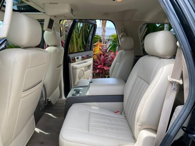 2004 Black /Light Parchment Lincoln Navigator LOW MILES 67,511 SUNROOF (5LMFU27R54L) with an 5.4L DOHC 32-Valve V8 Intech Engine engine, Automatic transmission, located at 4701 North Dixie Hwy, Pompano Beach, FL, 33064, (954) 422-2889, 26.240938, -80.123474 - OUR WEBPAGE FLORIDACARS1.COM HAS OVER 100 PHOTOS AND FREE CARFAX LINK 2004 Lincoln Navigator 4 Door Wagon/Sport Utility 5.4L V8 F DOHC Gasoline 17 MPG Rear Wheel Drive Features A/C Seat(s) ABS Brakes Air Conditioning Alloy Wheels AM/FM Stereo Automatic Transmission CD Audio Cruise Control Fold-Away- Photo#14