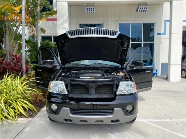 2004 Black /Light Parchment Lincoln Navigator LOW MILES 67,511 SUNROOF (5LMFU27R54L) with an 5.4L DOHC 32-Valve V8 Intech Engine engine, Automatic transmission, located at 4701 North Dixie Hwy, Pompano Beach, FL, 33064, (954) 422-2889, 26.240938, -80.123474 - OUR WEBPAGE FLORIDACARS1.COM HAS OVER 100 PHOTOS AND FREE CARFAX LINK 2004 Lincoln Navigator 4 Door Wagon/Sport Utility 5.4L V8 F DOHC Gasoline 17 MPG Rear Wheel Drive Features A/C Seat(s) ABS Brakes Air Conditioning Alloy Wheels AM/FM Stereo Automatic Transmission CD Audio Cruise Control Fold-Away- Photo#16
