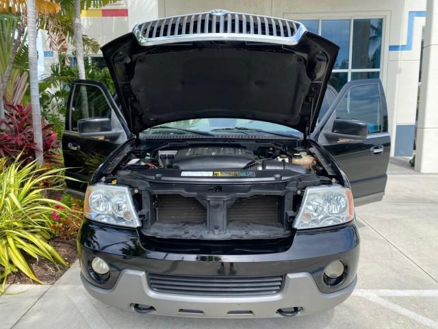 2004 Black /Light Parchment Lincoln Navigator LOW MILES 67,511 SUNROOF (5LMFU27R54L) with an 5.4L DOHC 32-Valve V8 Intech Engine engine, Automatic transmission, located at 4701 North Dixie Hwy, Pompano Beach, FL, 33064, (954) 422-2889, 26.240938, -80.123474 - OUR WEBPAGE FLORIDACARS1.COM HAS OVER 100 PHOTOS AND FREE CARFAX LINK 2004 Lincoln Navigator 4 Door Wagon/Sport Utility 5.4L V8 F DOHC Gasoline 17 MPG Rear Wheel Drive Features A/C Seat(s) ABS Brakes Air Conditioning Alloy Wheels AM/FM Stereo Automatic Transmission CD Audio Cruise Control Fold-Away- Photo#17