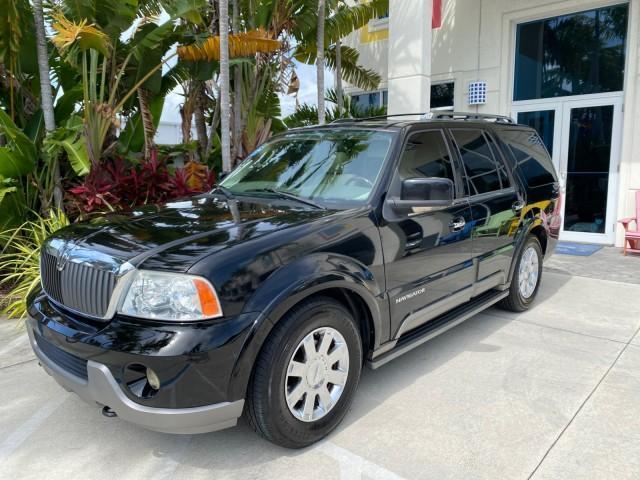 2004 Black /Light Parchment Lincoln Navigator LOW MILES 67,511 SUNROOF (5LMFU27R54L) with an 5.4L DOHC 32-Valve V8 Intech Engine engine, Automatic transmission, located at 4701 North Dixie Hwy, Pompano Beach, FL, 33064, (954) 422-2889, 26.240938, -80.123474 - OUR WEBPAGE FLORIDACARS1.COM HAS OVER 100 PHOTOS AND FREE CARFAX LINK 2004 Lincoln Navigator 4 Door Wagon/Sport Utility 5.4L V8 F DOHC Gasoline 17 MPG Rear Wheel Drive Features A/C Seat(s) ABS Brakes Air Conditioning Alloy Wheels AM/FM Stereo Automatic Transmission CD Audio Cruise Control Fold-Away- Photo#27