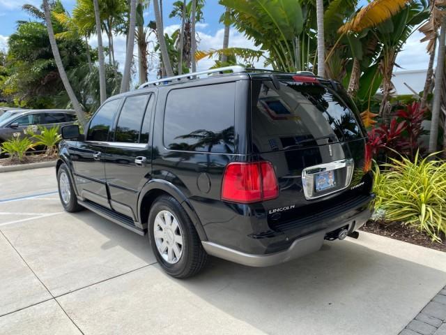 2004 Black /Light Parchment Lincoln Navigator LOW MILES 67,511 SUNROOF (5LMFU27R54L) with an 5.4L DOHC 32-Valve V8 Intech Engine engine, Automatic transmission, located at 4701 North Dixie Hwy, Pompano Beach, FL, 33064, (954) 422-2889, 26.240938, -80.123474 - OUR WEBPAGE FLORIDACARS1.COM HAS OVER 100 PHOTOS AND FREE CARFAX LINK 2004 Lincoln Navigator 4 Door Wagon/Sport Utility 5.4L V8 F DOHC Gasoline 17 MPG Rear Wheel Drive Features A/C Seat(s) ABS Brakes Air Conditioning Alloy Wheels AM/FM Stereo Automatic Transmission CD Audio Cruise Control Fold-Away- Photo#30