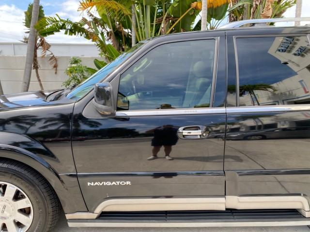 2004 Black /Light Parchment Lincoln Navigator LOW MILES 67,511 SUNROOF (5LMFU27R54L) with an 5.4L DOHC 32-Valve V8 Intech Engine engine, Automatic transmission, located at 4701 North Dixie Hwy, Pompano Beach, FL, 33064, (954) 422-2889, 26.240938, -80.123474 - OUR WEBPAGE FLORIDACARS1.COM HAS OVER 100 PHOTOS AND FREE CARFAX LINK 2004 Lincoln Navigator 4 Door Wagon/Sport Utility 5.4L V8 F DOHC Gasoline 17 MPG Rear Wheel Drive Features A/C Seat(s) ABS Brakes Air Conditioning Alloy Wheels AM/FM Stereo Automatic Transmission CD Audio Cruise Control Fold-Away- Photo#34