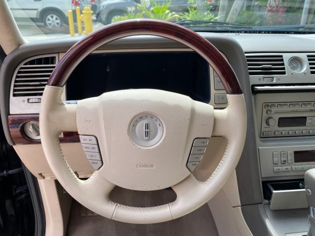 2004 Black /Light Parchment Lincoln Navigator LOW MILES 67,511 SUNROOF (5LMFU27R54L) with an 5.4L DOHC 32-Valve V8 Intech Engine engine, Automatic transmission, located at 4701 North Dixie Hwy, Pompano Beach, FL, 33064, (954) 422-2889, 26.240938, -80.123474 - OUR WEBPAGE FLORIDACARS1.COM HAS OVER 100 PHOTOS AND FREE CARFAX LINK 2004 Lincoln Navigator 4 Door Wagon/Sport Utility 5.4L V8 F DOHC Gasoline 17 MPG Rear Wheel Drive Features A/C Seat(s) ABS Brakes Air Conditioning Alloy Wheels AM/FM Stereo Automatic Transmission CD Audio Cruise Control Fold-Away- Photo#49