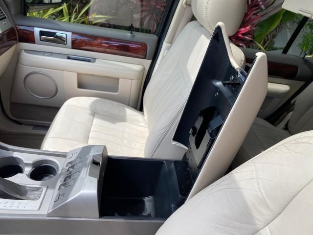 2004 Black /Light Parchment Lincoln Navigator LOW MILES 67,511 SUNROOF (5LMFU27R54L) with an 5.4L DOHC 32-Valve V8 Intech Engine engine, Automatic transmission, located at 4701 North Dixie Hwy, Pompano Beach, FL, 33064, (954) 422-2889, 26.240938, -80.123474 - OUR WEBPAGE FLORIDACARS1.COM HAS OVER 100 PHOTOS AND FREE CARFAX LINK 2004 Lincoln Navigator 4 Door Wagon/Sport Utility 5.4L V8 F DOHC Gasoline 17 MPG Rear Wheel Drive Features A/C Seat(s) ABS Brakes Air Conditioning Alloy Wheels AM/FM Stereo Automatic Transmission CD Audio Cruise Control Fold-Away- Photo#71