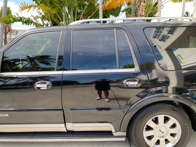 2004 Black /Light Parchment Lincoln Navigator LOW MILES 67,511 SUNROOF (5LMFU27R54L) with an 5.4L DOHC 32-Valve V8 Intech Engine engine, Automatic transmission, located at 4701 North Dixie Hwy, Pompano Beach, FL, 33064, (954) 422-2889, 26.240938, -80.123474 - OUR WEBPAGE FLORIDACARS1.COM HAS OVER 100 PHOTOS AND FREE CARFAX LINK 2004 Lincoln Navigator 4 Door Wagon/Sport Utility 5.4L V8 F DOHC Gasoline 17 MPG Rear Wheel Drive Features A/C Seat(s) ABS Brakes Air Conditioning Alloy Wheels AM/FM Stereo Automatic Transmission CD Audio Cruise Control Fold-Away- Photo#74