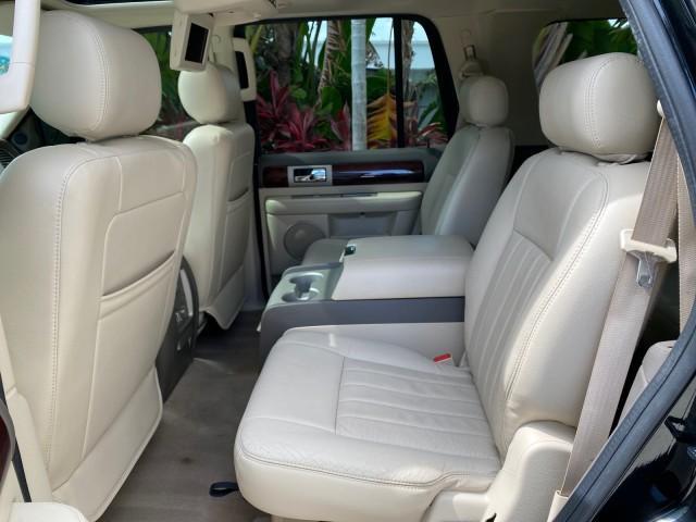 2004 Black /Light Parchment Lincoln Navigator LOW MILES 67,511 SUNROOF (5LMFU27R54L) with an 5.4L DOHC 32-Valve V8 Intech Engine engine, Automatic transmission, located at 4701 North Dixie Hwy, Pompano Beach, FL, 33064, (954) 422-2889, 26.240938, -80.123474 - OUR WEBPAGE FLORIDACARS1.COM HAS OVER 100 PHOTOS AND FREE CARFAX LINK 2004 Lincoln Navigator 4 Door Wagon/Sport Utility 5.4L V8 F DOHC Gasoline 17 MPG Rear Wheel Drive Features A/C Seat(s) ABS Brakes Air Conditioning Alloy Wheels AM/FM Stereo Automatic Transmission CD Audio Cruise Control Fold-Away- Photo#77