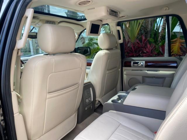 2004 Black /Light Parchment Lincoln Navigator LOW MILES 67,511 SUNROOF (5LMFU27R54L) with an 5.4L DOHC 32-Valve V8 Intech Engine engine, Automatic transmission, located at 4701 North Dixie Hwy, Pompano Beach, FL, 33064, (954) 422-2889, 26.240938, -80.123474 - OUR WEBPAGE FLORIDACARS1.COM HAS OVER 100 PHOTOS AND FREE CARFAX LINK 2004 Lincoln Navigator 4 Door Wagon/Sport Utility 5.4L V8 F DOHC Gasoline 17 MPG Rear Wheel Drive Features A/C Seat(s) ABS Brakes Air Conditioning Alloy Wheels AM/FM Stereo Automatic Transmission CD Audio Cruise Control Fold-Away- Photo#78