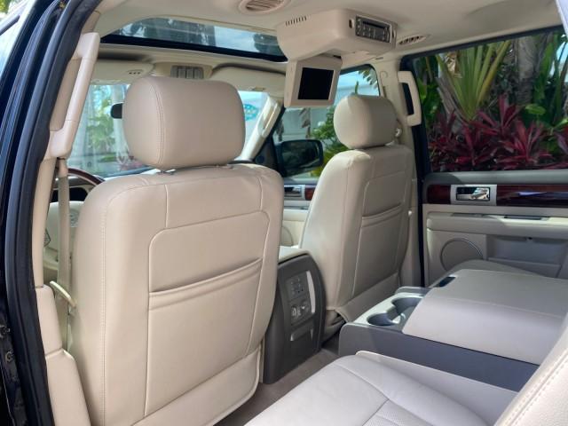 2004 Black /Light Parchment Lincoln Navigator LOW MILES 67,511 SUNROOF (5LMFU27R54L) with an 5.4L DOHC 32-Valve V8 Intech Engine engine, Automatic transmission, located at 4701 North Dixie Hwy, Pompano Beach, FL, 33064, (954) 422-2889, 26.240938, -80.123474 - OUR WEBPAGE FLORIDACARS1.COM HAS OVER 100 PHOTOS AND FREE CARFAX LINK 2004 Lincoln Navigator 4 Door Wagon/Sport Utility 5.4L V8 F DOHC Gasoline 17 MPG Rear Wheel Drive Features A/C Seat(s) ABS Brakes Air Conditioning Alloy Wheels AM/FM Stereo Automatic Transmission CD Audio Cruise Control Fold-Away- Photo#79