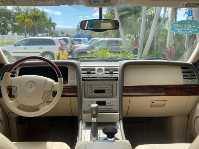 2004 Black /Light Parchment Lincoln Navigator LOW MILES 67,511 SUNROOF (5LMFU27R54L) with an 5.4L DOHC 32-Valve V8 Intech Engine engine, Automatic transmission, located at 4701 North Dixie Hwy, Pompano Beach, FL, 33064, (954) 422-2889, 26.240938, -80.123474 - OUR WEBPAGE FLORIDACARS1.COM HAS OVER 100 PHOTOS AND FREE CARFAX LINK 2004 Lincoln Navigator 4 Door Wagon/Sport Utility 5.4L V8 F DOHC Gasoline 17 MPG Rear Wheel Drive Features A/C Seat(s) ABS Brakes Air Conditioning Alloy Wheels AM/FM Stereo Automatic Transmission CD Audio Cruise Control Fold-Away- Photo#81