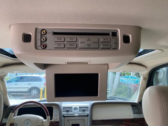 2004 Black /Light Parchment Lincoln Navigator LOW MILES 67,511 SUNROOF (5LMFU27R54L) with an 5.4L DOHC 32-Valve V8 Intech Engine engine, Automatic transmission, located at 4701 North Dixie Hwy, Pompano Beach, FL, 33064, (954) 422-2889, 26.240938, -80.123474 - OUR WEBPAGE FLORIDACARS1.COM HAS OVER 100 PHOTOS AND FREE CARFAX LINK 2004 Lincoln Navigator 4 Door Wagon/Sport Utility 5.4L V8 F DOHC Gasoline 17 MPG Rear Wheel Drive Features A/C Seat(s) ABS Brakes Air Conditioning Alloy Wheels AM/FM Stereo Automatic Transmission CD Audio Cruise Control Fold-Away- Photo#82