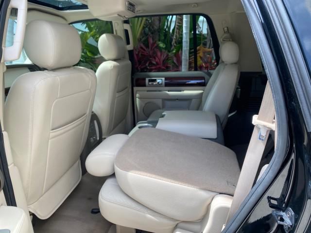 2004 Black /Light Parchment Lincoln Navigator LOW MILES 67,511 SUNROOF (5LMFU27R54L) with an 5.4L DOHC 32-Valve V8 Intech Engine engine, Automatic transmission, located at 4701 North Dixie Hwy, Pompano Beach, FL, 33064, (954) 422-2889, 26.240938, -80.123474 - OUR WEBPAGE FLORIDACARS1.COM HAS OVER 100 PHOTOS AND FREE CARFAX LINK 2004 Lincoln Navigator 4 Door Wagon/Sport Utility 5.4L V8 F DOHC Gasoline 17 MPG Rear Wheel Drive Features A/C Seat(s) ABS Brakes Air Conditioning Alloy Wheels AM/FM Stereo Automatic Transmission CD Audio Cruise Control Fold-Away- Photo#86