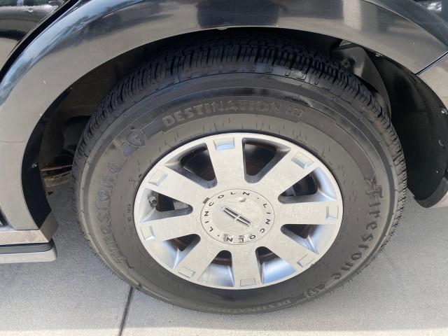 2004 Black /Light Parchment Lincoln Navigator LOW MILES 67,511 SUNROOF (5LMFU27R54L) with an 5.4L DOHC 32-Valve V8 Intech Engine engine, Automatic transmission, located at 4701 North Dixie Hwy, Pompano Beach, FL, 33064, (954) 422-2889, 26.240938, -80.123474 - OUR WEBPAGE FLORIDACARS1.COM HAS OVER 100 PHOTOS AND FREE CARFAX LINK 2004 Lincoln Navigator 4 Door Wagon/Sport Utility 5.4L V8 F DOHC Gasoline 17 MPG Rear Wheel Drive Features A/C Seat(s) ABS Brakes Air Conditioning Alloy Wheels AM/FM Stereo Automatic Transmission CD Audio Cruise Control Fold-Away- Photo#93