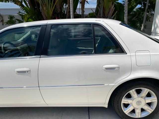 2006 Glacier White /Cashmere Cadillac DTS LOW MILES 58,287 (1G6KD57Y96U) with an 4.6L DOHC V8 Northstar Engine engine, Automatic transmission, located at 4701 North Dixie Hwy, Pompano Beach, FL, 33064, (954) 422-2889, 26.240938, -80.123474 - OUR WEBPAGE FLORIDACARS1.COM HAS OVER 100 PHOTOS AND FREE CARFAX LINK 2006 Cadillac DTS Sedan 4 DR 4.6L V8 F Gasoline 25 MPG Front Wheel Drive Features ABS Brakes Air Conditioning Alloy Wheels AM/FM Stereo Automatic Transmission Bluetooth Technology CD Audio Cruise Control Leather Seats Overhead Air- Photo#71