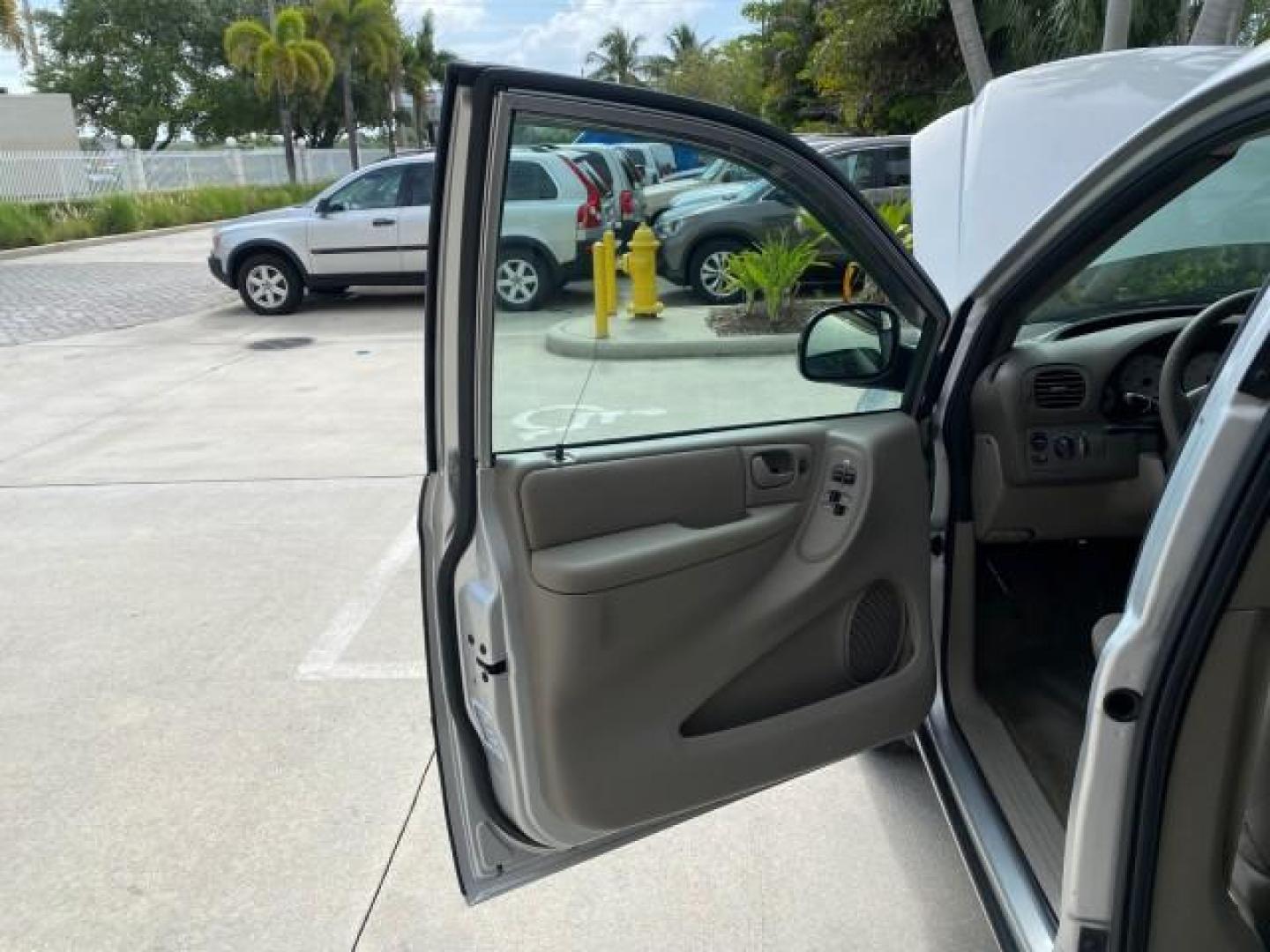 2003 Bright Silver Metallic /Taupe Dodge Caravan Sport LOW MILES 45,416 1 OWNER (2D4GP44L83R) with an 3.8L SMPI V6 Engine engine, Automatic transmission, located at 4701 North Dixie Hwy, Pompano Beach, FL, 33064, (954) 422-2889, 26.240938, -80.123474 - OUR WEBPAGE FLORIDACARS1.COM HAS OVER 100 PHOTOS AND FREE CARFAX LINK 2003 Dodge Grand Caravan Sport 1 OWNER Van 3.8L V6 F OHV 12V Gasoline 25 MPG Front Wheel Drive Features ABS Brakes Air Conditioning Alloy Wheels AM/FM Stereo Automatic Transmission Cassette Player CD Audio Cloth Seats Cruise Contr- Photo#9