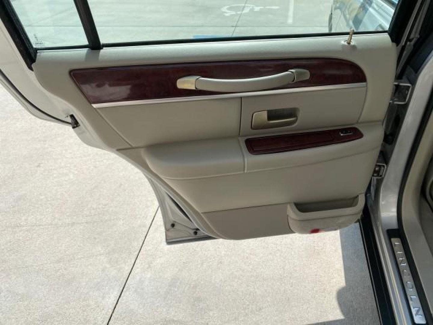 2005 Light French Silk Metallic /Med/Lt Parchment Lincoln Town Car Signature Limited LOW MILES 84,448 (1LNHM82W55Y) with an 4.6L SOHC SMPI V8 Engine engine, Automatic transmission, located at 4701 North Dixie Hwy, Pompano Beach, FL, 33064, (954) 422-2889, 26.240938, -80.123474 - OUR WEBPAGE FLORIDACARS1.COM HAS OVER 100 PHOTOS AND FREE CARFAX LINK 2005 Lincoln Town Car Signature Limited Sedan 4 DR 4.6L V8 F OHV 16V Gasoline 25 MPG Rear Wheel Drive Features ABS Brakes Air Conditioning Alloy Wheels AM/FM Stereo Audiophile Sound System Automatic Transmission Cassette Player CD- Photo#83