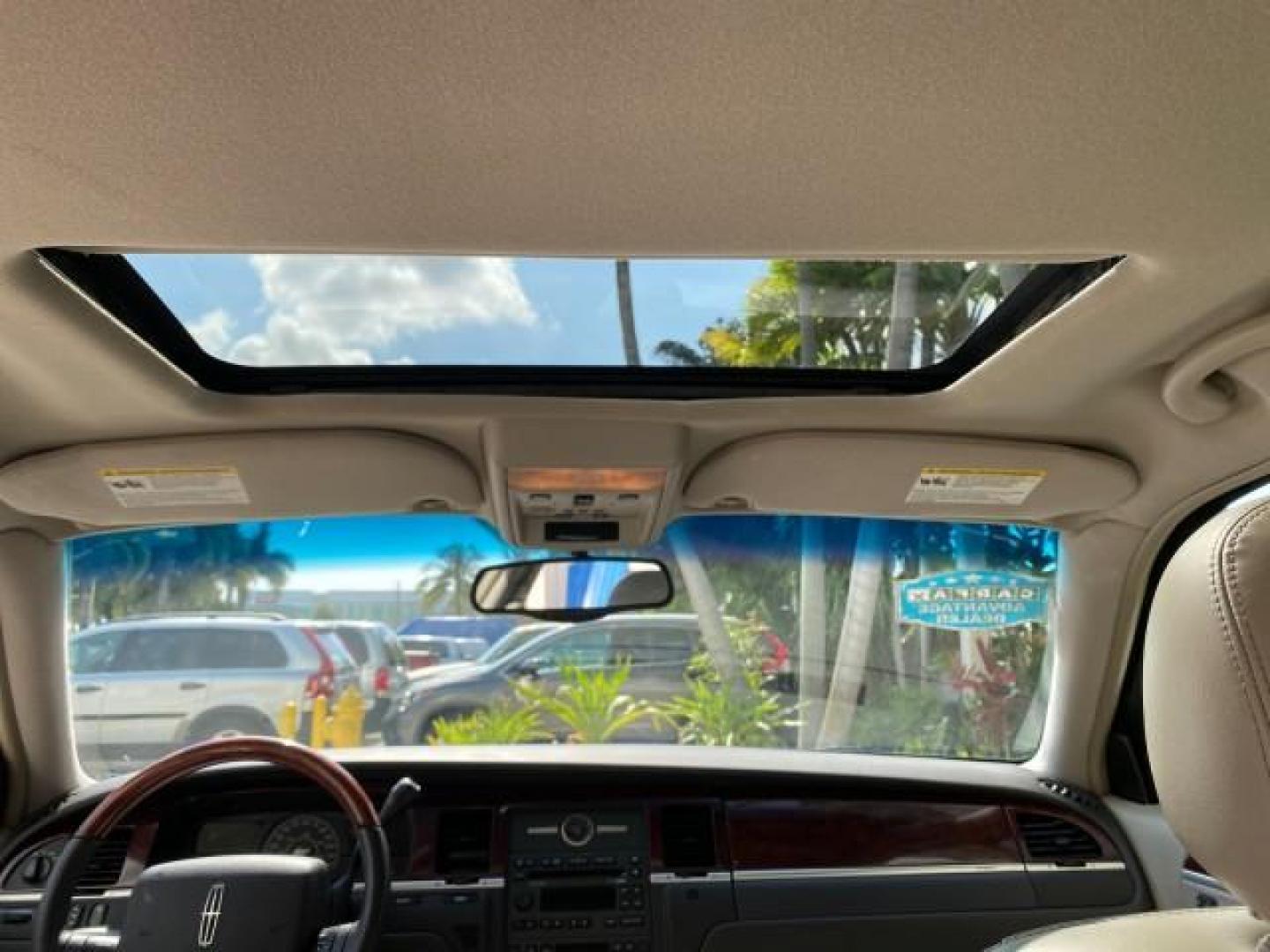 2005 Light French Silk Metallic /Med/Lt Parchment Lincoln Town Car Signature Limited LOW MILES 84,448 (1LNHM82W55Y) with an 4.6L SOHC SMPI V8 Engine engine, Automatic transmission, located at 4701 North Dixie Hwy, Pompano Beach, FL, 33064, (954) 422-2889, 26.240938, -80.123474 - OUR WEBPAGE FLORIDACARS1.COM HAS OVER 100 PHOTOS AND FREE CARFAX LINK 2005 Lincoln Town Car Signature Limited Sedan 4 DR 4.6L V8 F OHV 16V Gasoline 25 MPG Rear Wheel Drive Features ABS Brakes Air Conditioning Alloy Wheels AM/FM Stereo Audiophile Sound System Automatic Transmission Cassette Player CD- Photo#93