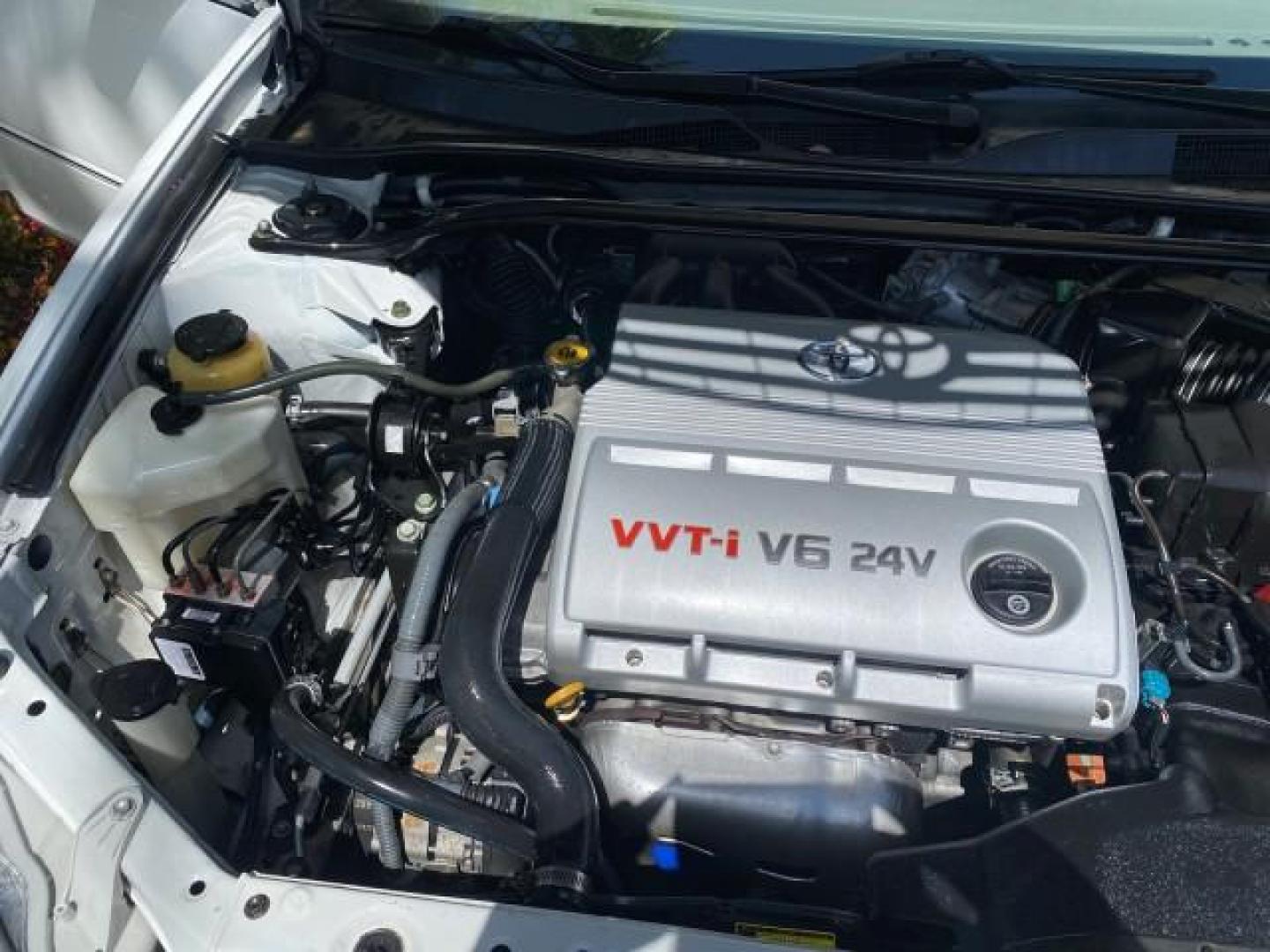 2006 Super White /Taupe Toyota Camry XLE V6 LOW MILES 65,439 (4T1BF30K76U) with an 3.0L DOHC SEFI 24-Valve V6 Engine engine, Automatic transmission, located at 4701 North Dixie Hwy, Pompano Beach, FL, 33064, (954) 422-2889, 26.240938, -80.123474 - OUR WEBPAGE FLORIDACARS1.COM HAS OVER 100 PHOTOS AND FREE CARFAX LINK 2006 Toyota Camry XLE V6 1 OWNER Sedan 4 DR 3.0L V6 F DOHC 24V Gasoline 29 MPG Front Wheel Drive Features ABS Brakes Air Conditioning Alloy Wheels AM/FM Stereo Automatic Transmission Cassette Player CD Audio Cruise Control JBL Sou- Photo#24