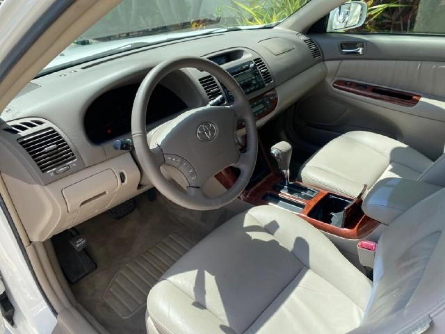 2006 Super White /Taupe Toyota Camry XLE V6 LOW MILES 65,439 (4T1BF30K76U) with an 3.0L DOHC SEFI 24-Valve V6 Engine engine, Automatic transmission, located at 4701 North Dixie Hwy, Pompano Beach, FL, 33064, (954) 422-2889, 26.240938, -80.123474 - OUR WEBPAGE FLORIDACARS1.COM HAS OVER 100 PHOTOS AND FREE CARFAX LINK 2006 Toyota Camry XLE V6 1 OWNER Sedan 4 DR 3.0L V6 F DOHC 24V Gasoline 29 MPG Front Wheel Drive Features ABS Brakes Air Conditioning Alloy Wheels AM/FM Stereo Automatic Transmission Cassette Player CD Audio Cruise Control JBL Sou- Photo#46