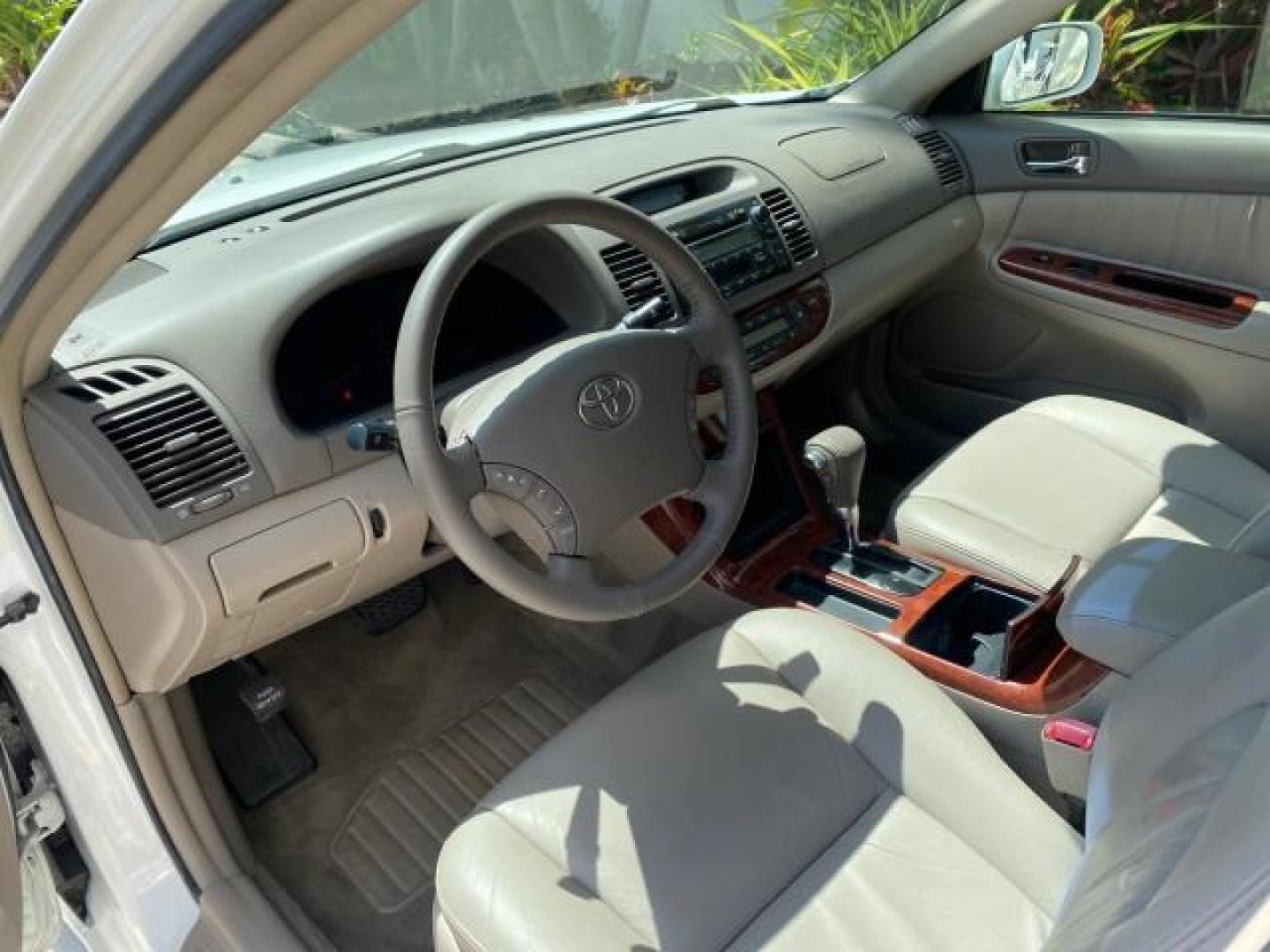 2006 Super White /Taupe Toyota Camry XLE V6 LOW MILES 65,439 (4T1BF30K76U) with an 3.0L DOHC SEFI 24-Valve V6 Engine engine, Automatic transmission, located at 4701 North Dixie Hwy, Pompano Beach, FL, 33064, (954) 422-2889, 26.240938, -80.123474 - OUR WEBPAGE FLORIDACARS1.COM HAS OVER 100 PHOTOS AND FREE CARFAX LINK 2006 Toyota Camry XLE V6 1 OWNER Sedan 4 DR 3.0L V6 F DOHC 24V Gasoline 29 MPG Front Wheel Drive Features ABS Brakes Air Conditioning Alloy Wheels AM/FM Stereo Automatic Transmission Cassette Player CD Audio Cruise Control JBL Sou- Photo#47